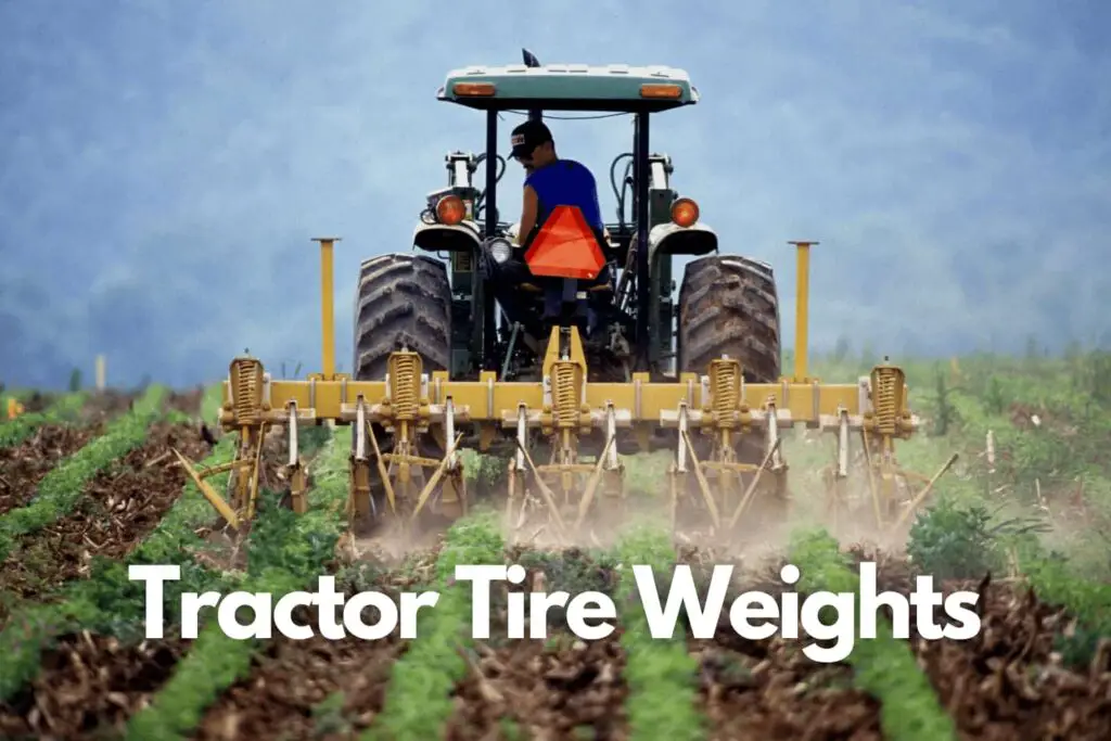 farm tractor tilling ground rolling on the large tires