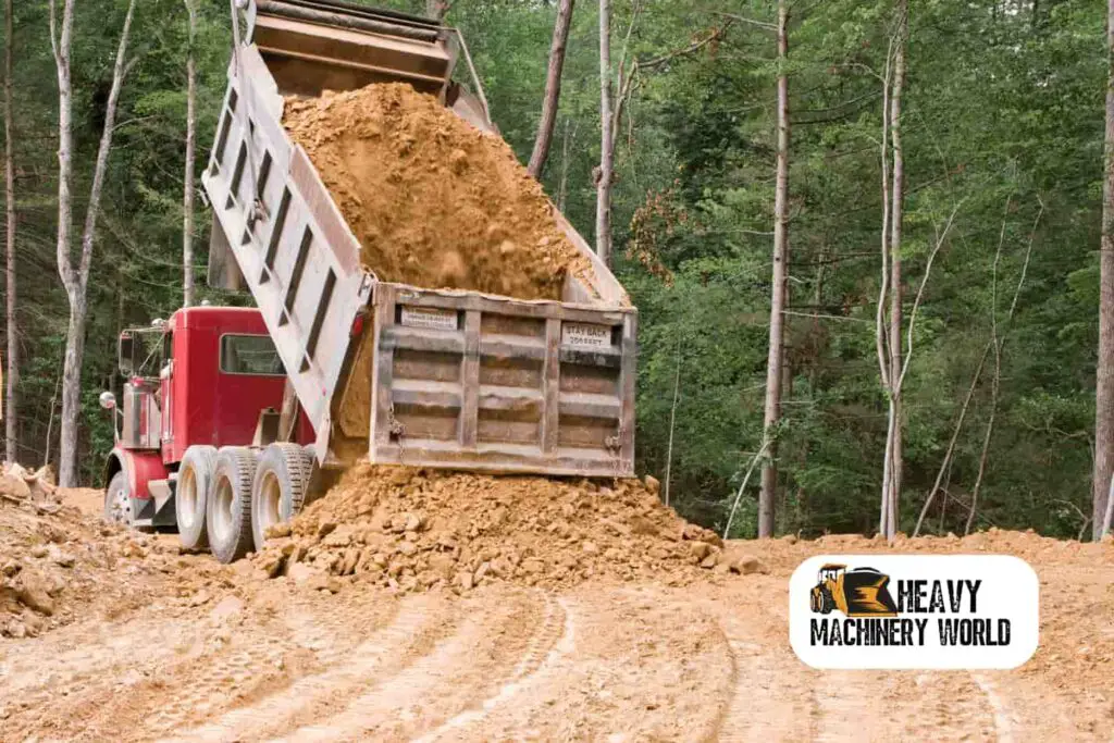 Dump truck dropping a load of dirt in a construction site